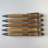 Custom corporate event gifts, these wood pens are personalised both sides with a company logo and attendee name
