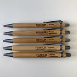Custom corporate event gifts, these wood pens are personalised both sides with a company logo and attendee name