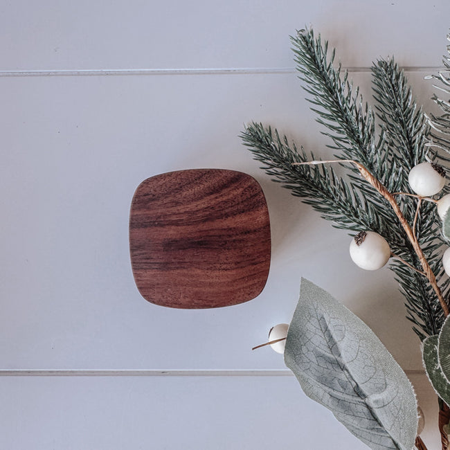 Rounded square ring box in walnut engraved here in New Zealand