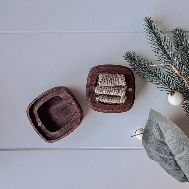 The hessian filling in our walnut rounded square ring box